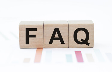 FAQ or frequently asked question concept. Wooden blocks with text on desk. Copy space