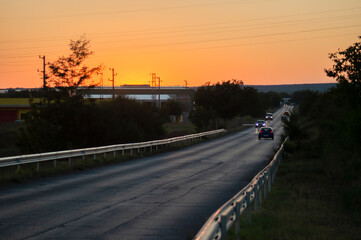 Road with cars at sunset