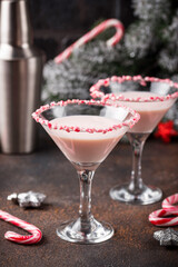 Pink peppermint martini with candy cane rim