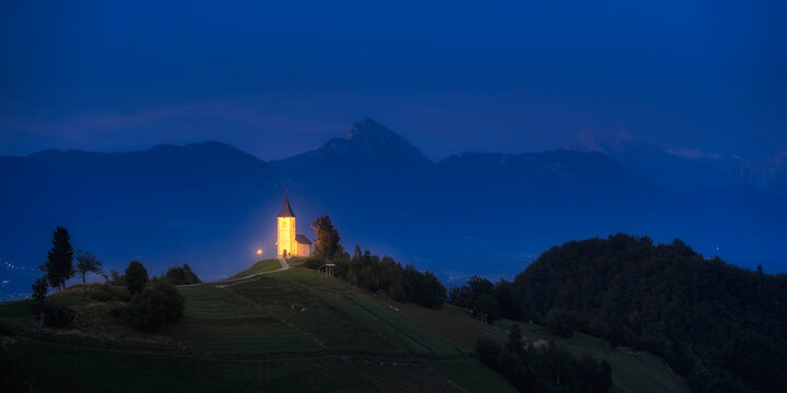 The Church Of Saint Primoz on hill at night