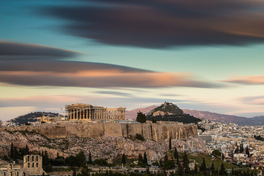 Acropolis of Athens against cloudy sky