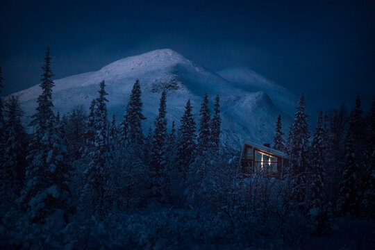 View of cabin at night - Powered by Adobe