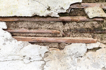 Background of old tiles with cement mortar with collapsed plaster, close-up, side view