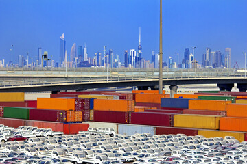 Colorful Shipping Containers And Vehicles Near Kuwait City Urban Skyline