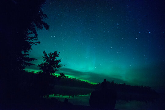Scenic view of Aurora Borealis over Cherokee Lake at night
