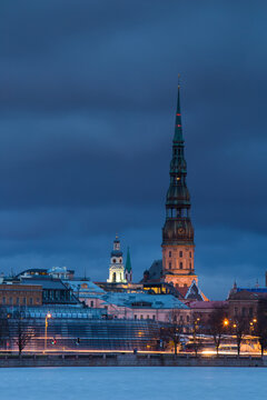Exterior view of houses and tower at night
