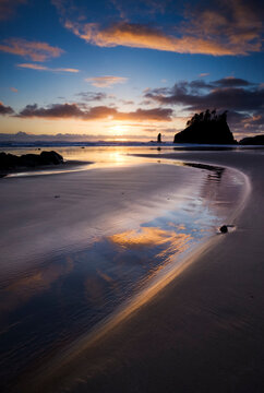 Scenic view of Second Beach against cloudy sky during sunset