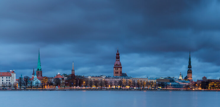 View of Riga city against cloudy sky at dusk