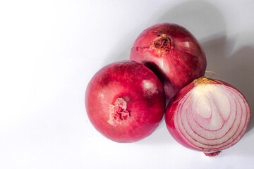 Red onions on white background in Brazil