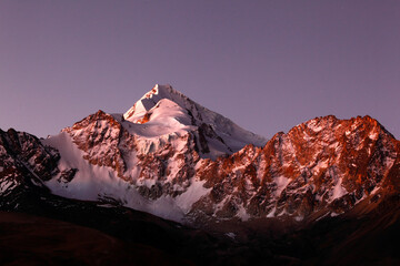 Scenic view of Mount Huayna Potosi covered with snow at twilight