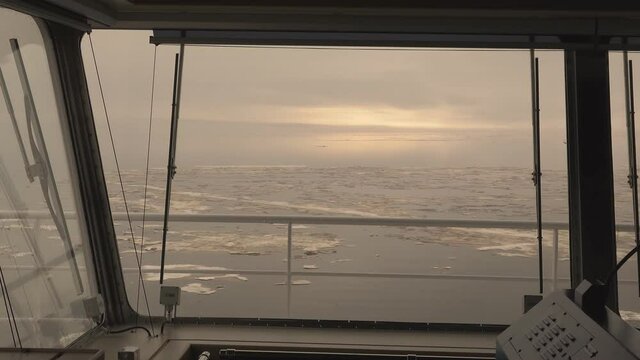 The Arctic landscape of the Arctic Ocean. Ice and cold. The Arctic landscape is from the tanker's cabin control.