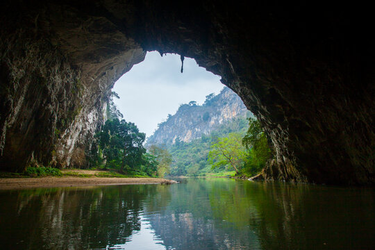 View of cliffs seen from cave along river in forest of Ba Be National Park, Vietnam