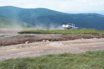 SUV car on a mountain trail
