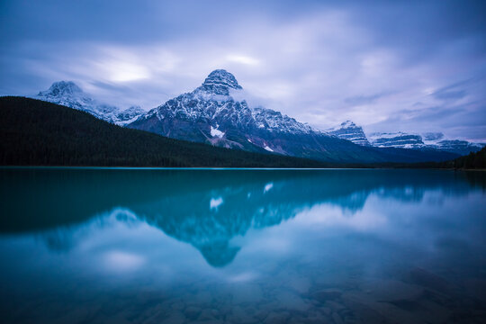 Scenic view of Mount Chephren with Waterfowl Lake in foreground at dusk