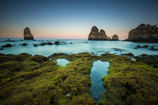 View of Praia do Camilo beach during sunset