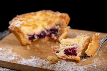 A piece of tasty cake on a fork. Dessert prepared for serving.
