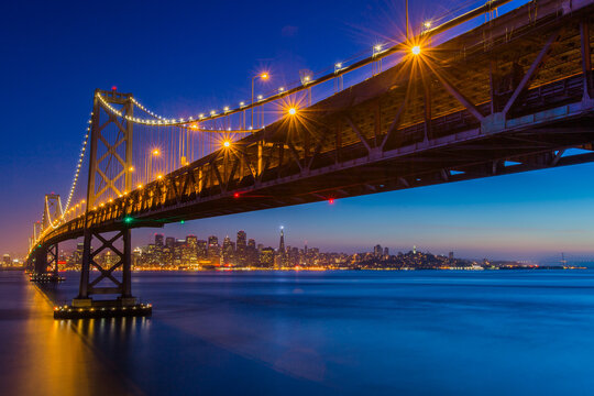 View of Bay Bridge with city in background, San Francisco, USA