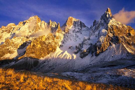 Cimon della Pala covered in snow during sunset