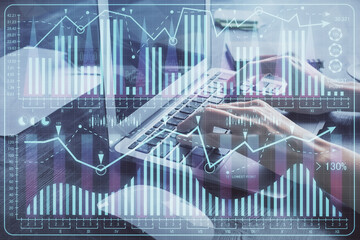 Double exposure of woman hands typing on computer and forex chart hologram drawing. Stock market invest concept.