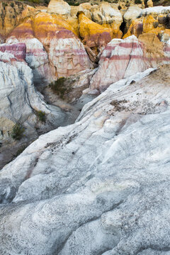 Colorful clays and rock formations in Paint Mines Interpretive Park during sunset