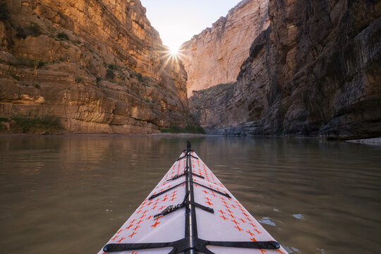 Kayak in Rio Grande river against Santa Elena Canyon