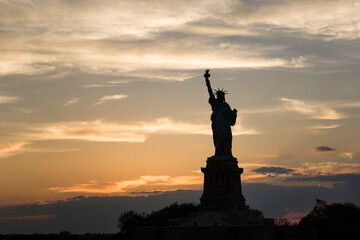 View of Statue of Liberty against cloudy sky during sunset