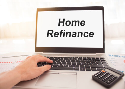 Laptop With Words Home Refinance On White Screen, Business And Finance Concept.