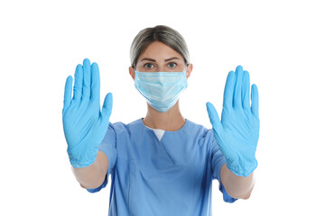 Doctor in protective mask showing stop gesture on white background. Prevent spreading of coronavirus