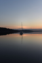 Fototapeta na wymiar boat on the water at sunrise