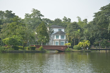 Ninoy Aquino parks and wildlife water lagoon plus house facade in Quezon City, Philippines