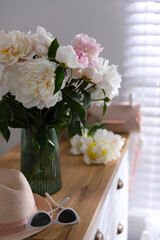 Bouquet of beautiful peony flowers in room