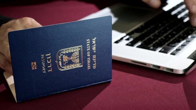 Israeli citizen insert data from International Travel document Passport for buy ticket or registration. Visa Application online Form Immigration Concept