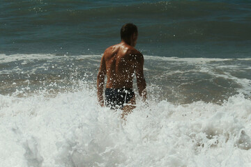 boy running on the beach