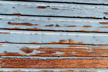 Weathered paint on wooden wall