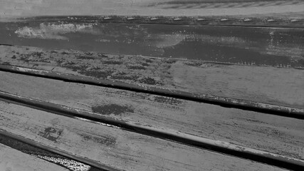 Obraz premium Texture color for the wooden chaise lounge, with traces of peeling paint from time, vintage close-up background concept.