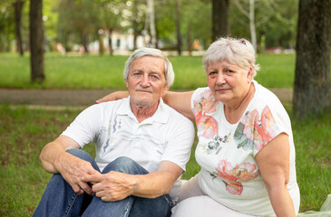 Old man and attractive old woman are enjoying spending time together