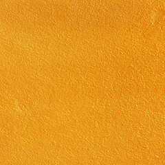 Naklejka premium Gold or yellow paint on cement wall texture or backgrond