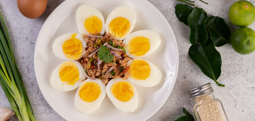 Half boiled egg and Pork Larb on a plate