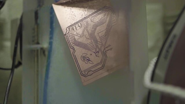 The pcb board revealing process, a plate is put under a treatment bath. Give copper a clean and shiny aspect.
