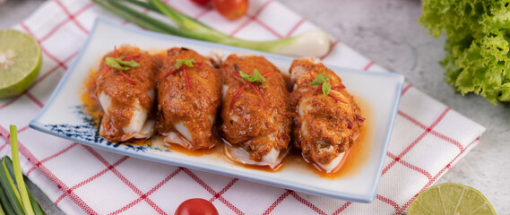 Chu che squid with spring onion, tomato, lemon and chili.