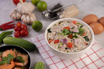 Shrimp Salad with Tomato Red onion and coriander in a white cup.