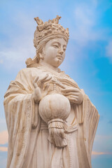Fototapeta na wymiar Mazu - a Chinese sea goddess, the statue situated on the side of Tianhou Temple at Guwenhua Jie street. in Tianjin, China