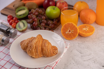 Croissant in a white plate.
