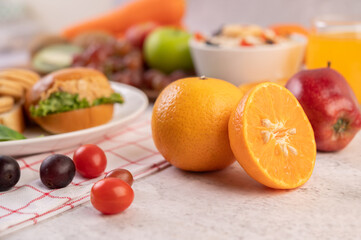Orange cut in half and grapes.