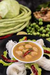 Rice noodle and coconut milk solution.