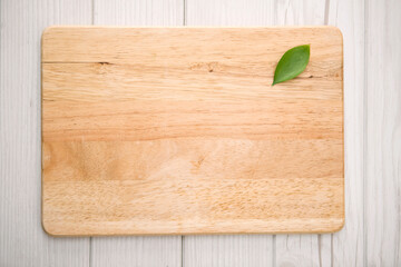 wooden plate with a leaf