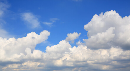 Naklejka na ściany i meble Beautiful blue sky with white fluffy cloud background