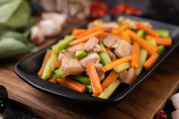 Stir-fried carrots and cucumber with pork belly.