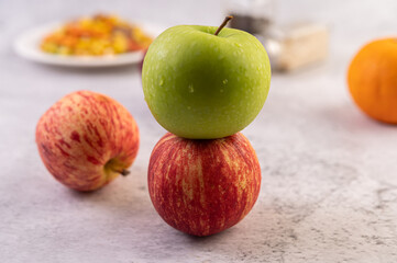 Apple on the white cement floor