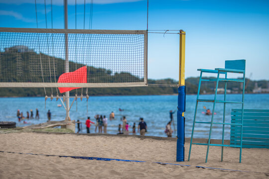 Blurred abstract background of seat made of wood and painted in blue, for sitting on beach volleyball.